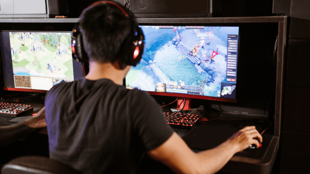 teenage boy playing PC game