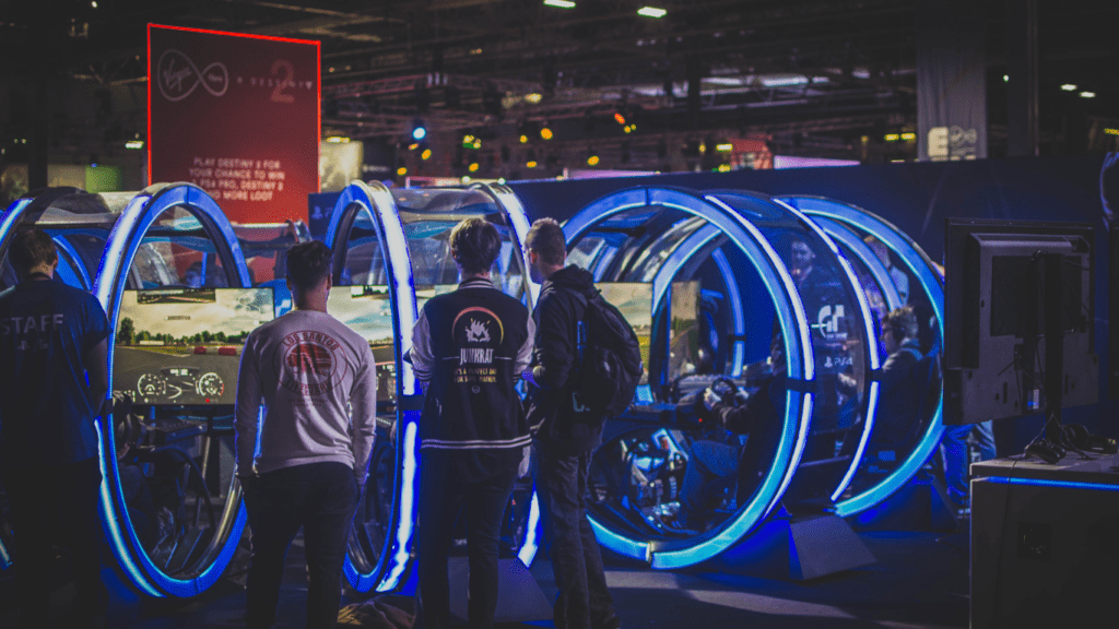 men in racing arcade machines