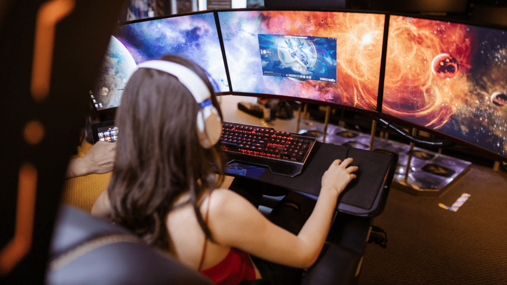 young woman playing pc games