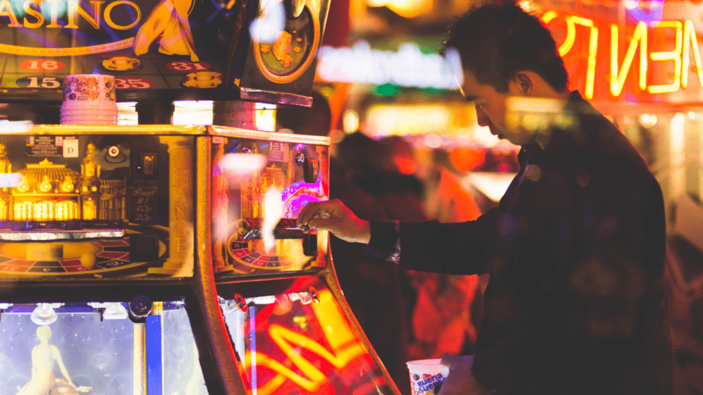 man betting in slot machine