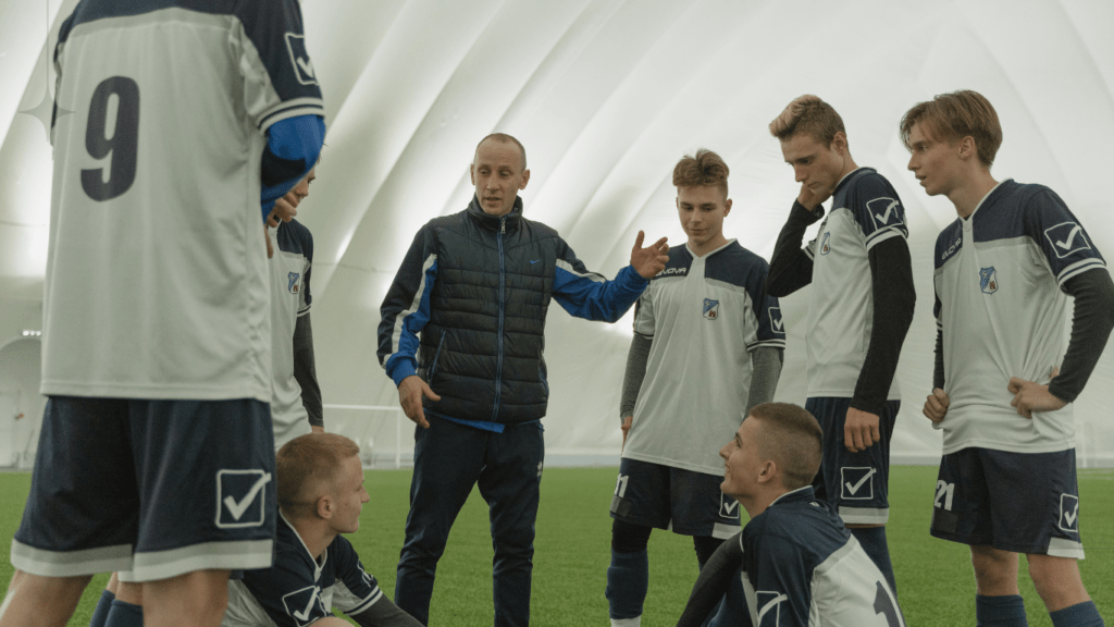 A coach talking to his team