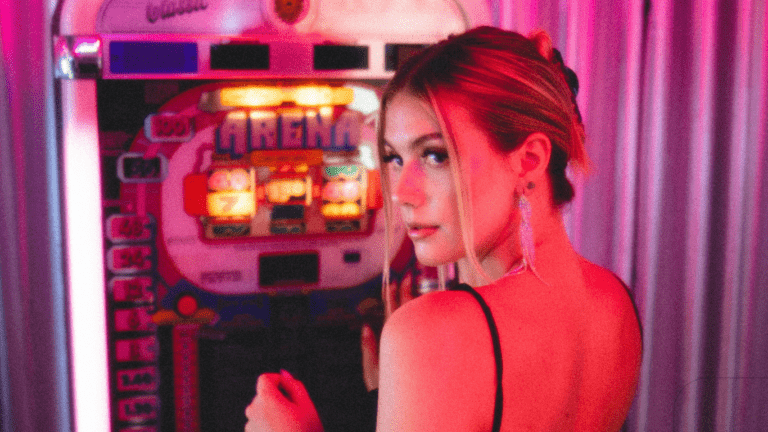 woman standing in front of slot machine