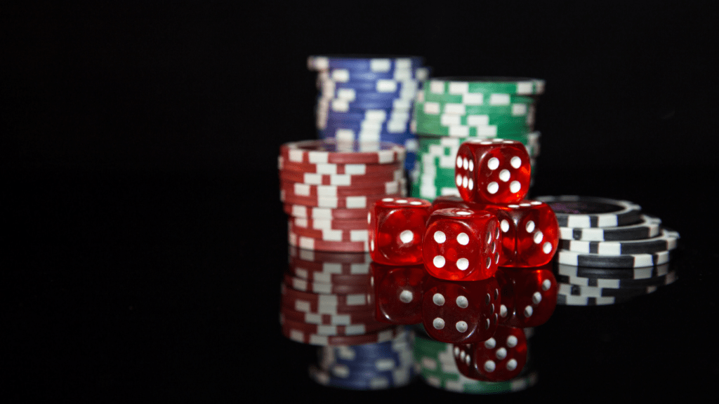 dice and chips in black background