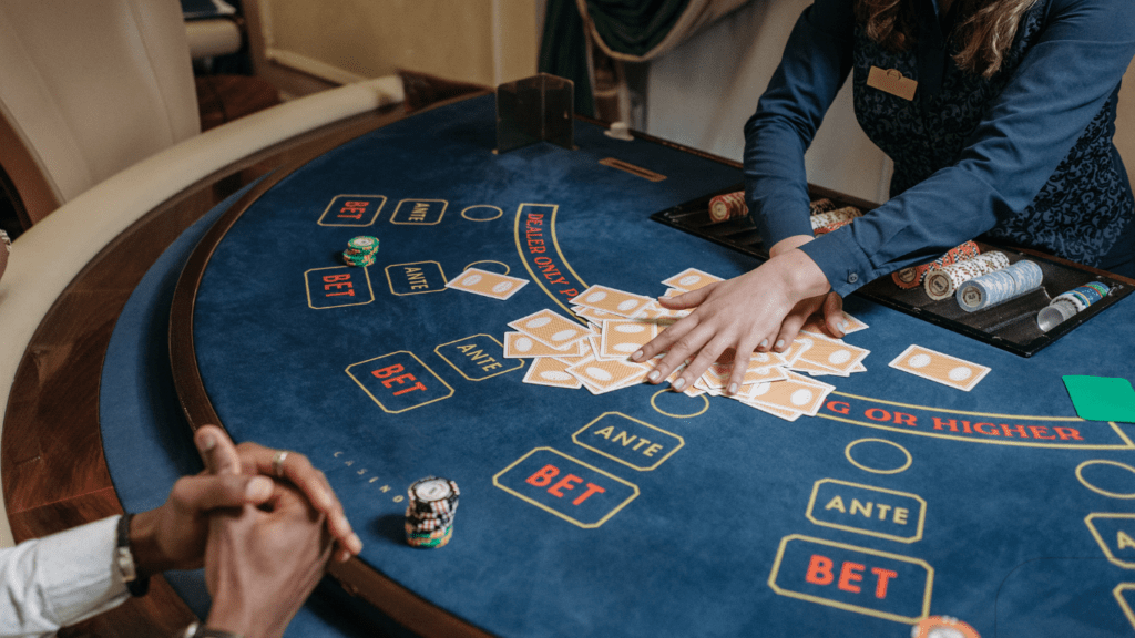 a woman dealer holding cards