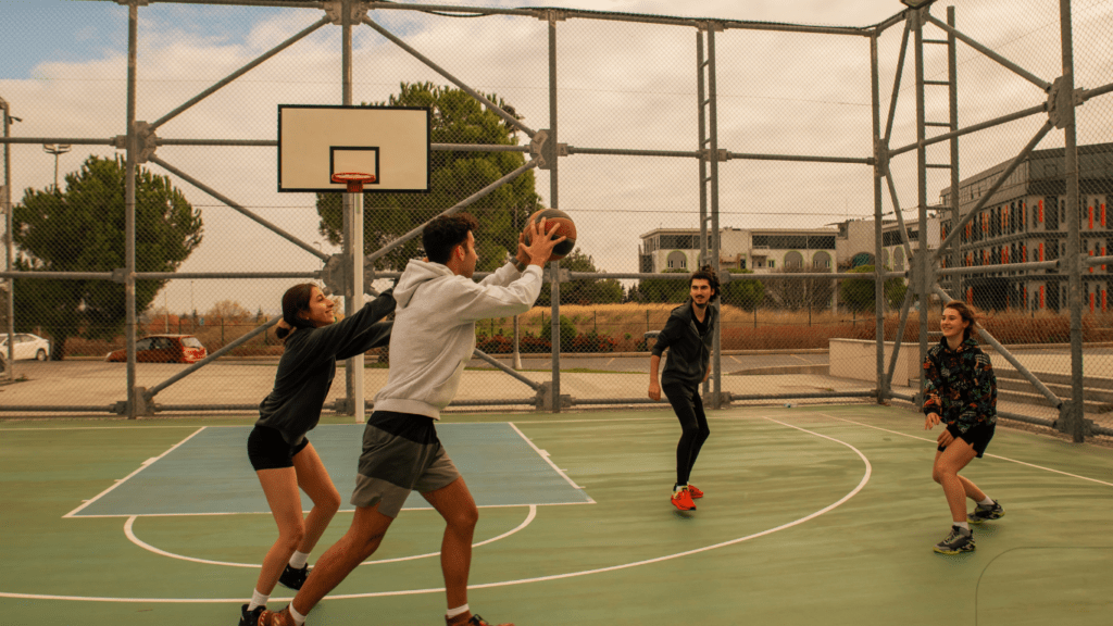 friends playing basketball outdoor