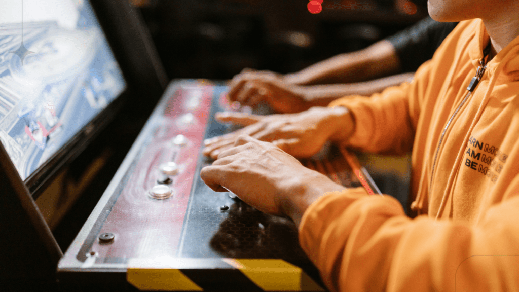 man playing an arcade game