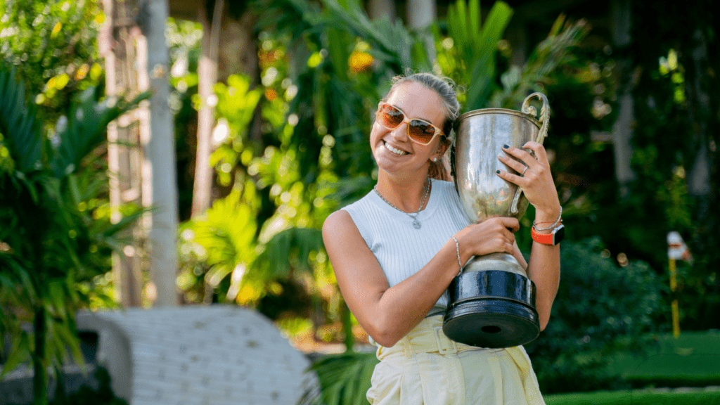 woman holding trophy